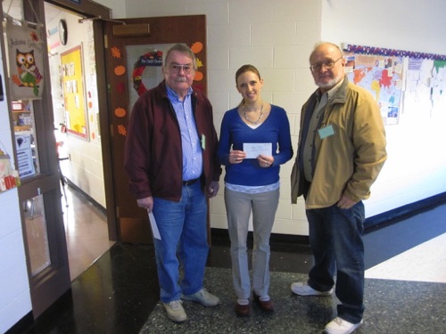 2015 Winner - April Clark, primary reading teacher in the Watertown CSD. Pictured with Richard Edwards, and Lynn Hunneyman.